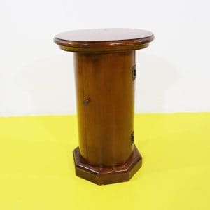 Mobiletto cilindrico in legno con anta e base ottagonale